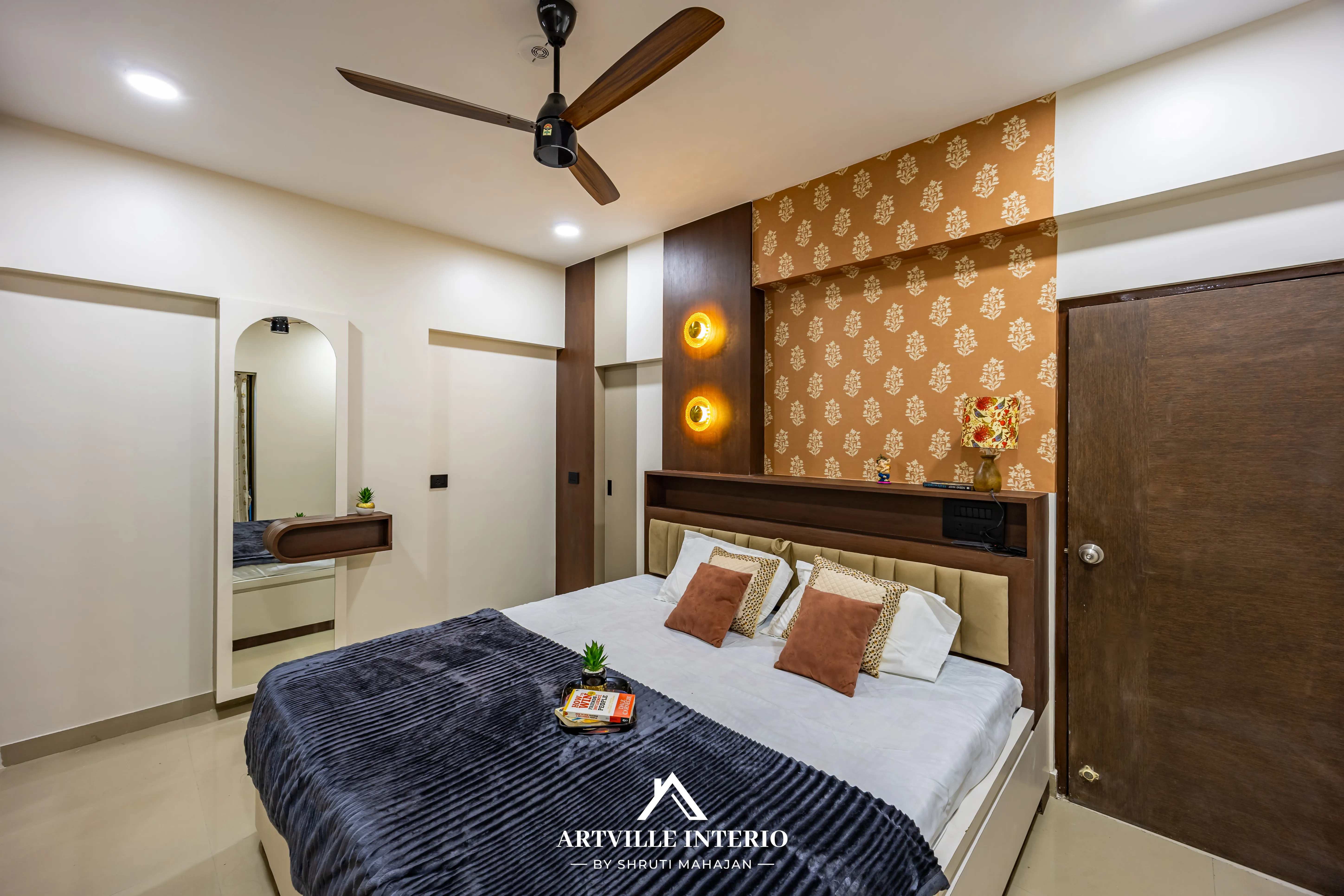 Elegant and space-optimized master bedroom featuring custom wardrobes and modern lighting design